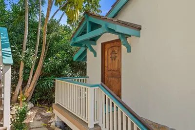 a wooden door on the side of a house at Blue Ocean View Retreat - Minutes to Beach in Summerland