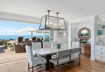 a dining room with a table and a view of the ocean at Seacliff Beach Retreat - Amazing Beachfront for Family of 6 in Ventura