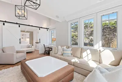 a living room with a couch and a table at Seacliff Beach Retreat - Amazing Beachfront for Family of 6 in Ventura