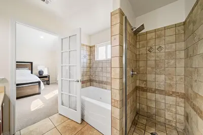 a bathroom with a shower and a bath tub at Modern townhouse - 4 Bedroom 3Bathroom near Pasadena, LA in Duarte