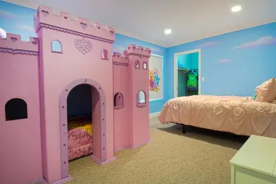 a bedroom with a pink castle bed in a room at F-16 Pirates Lair in Anaheim