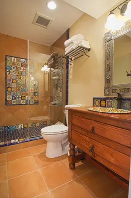 a bathroom with a toilet and a shower and a sink at F-16 Pirates Lair in Anaheim