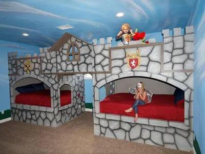 a fake castle bedroom with a girl sitting on a bed at F-28 The Wonderland House in Anaheim