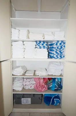 a refrigerator filled with lots of white towels at F-29 The Pirates Cove in Anaheim
