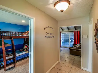 a room with two bunk beds and a hallway at F-29 The Pirates Cove in Anaheim