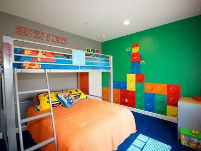 a bedroom with a bunk bed with a lego wall at F-31 Mickeys Beach House in Anaheim