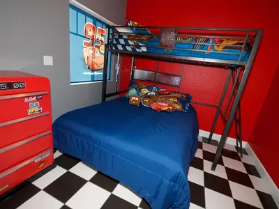 a bedroom with a bunk bed with toy cars on it at F-31 Mickeys Beach House in Anaheim