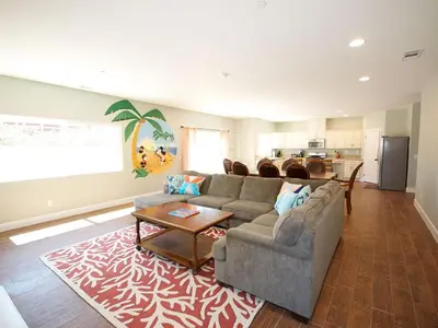 a living room with a couch and a table at F-31 Mickeys Beach House in Anaheim