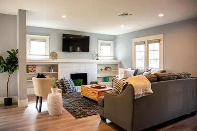 a living room with a couch and a fireplace at F-39 Helena in Anaheim