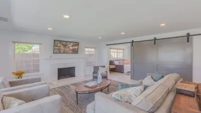 a living room with two couches and a fireplace at F-51 Orangewood in Anaheim