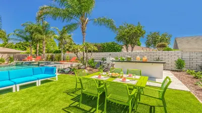 a patio with a table and chairs and a pool at F-51 Orangewood in Anaheim