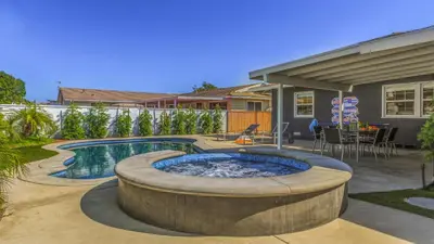 a backyard with a hot tub and a house at F-53 Trenton in Anaheim