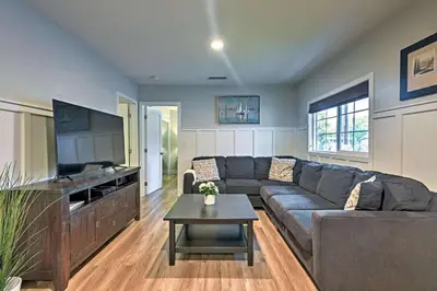 a living room with a couch and a table at F-55 Donald Ducks Cottage in Anaheim