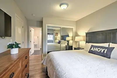 a bedroom with a large bed and a television at F-55 Donald Ducks Cottage in Anaheim