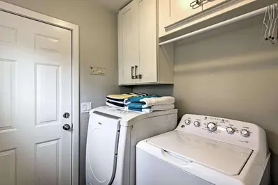 a small kitchen with a washing machine and a washer at F-55 Donald Ducks Cottage in Anaheim