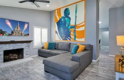a living room with a couch and a fireplace at F-58 Mandos Hideaway in Anaheim
