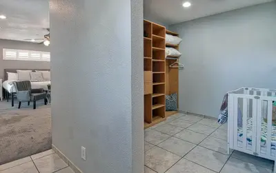 a room with a crib and a room with a bedroom at F-58 Mandos Hideaway in Anaheim