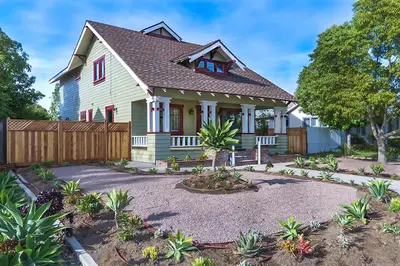 a house with a fence and a yard at F-60 Disney Dream Craftsman in Anaheim