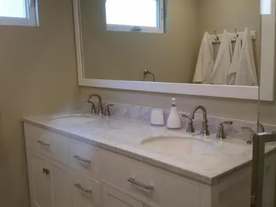 a bathroom with two sinks and a large mirror at F-60 Disney Dream Craftsman in Anaheim