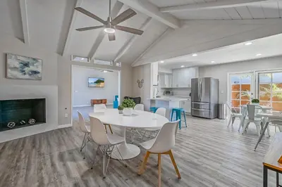 a dining room and kitchen with a table and chairs at F-65 Adventure House in Anaheim