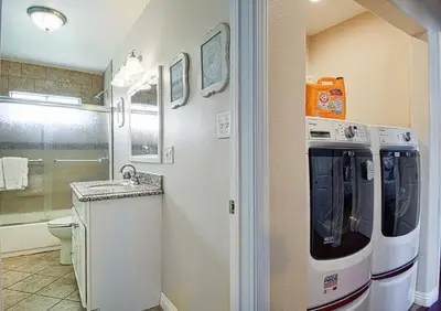 a bathroom with a toilet and a sink in it at F-18 Babes in Toyland in Anaheim