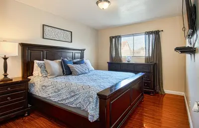 a bedroom with a bed and a window at F-18 Babes in Toyland in Anaheim