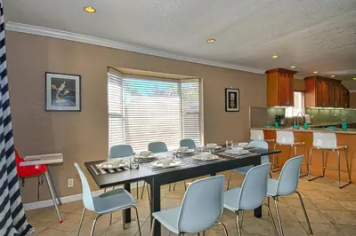 a dining room with a table and chairs and a kitchen at F-20 Paradise Pier in Anaheim