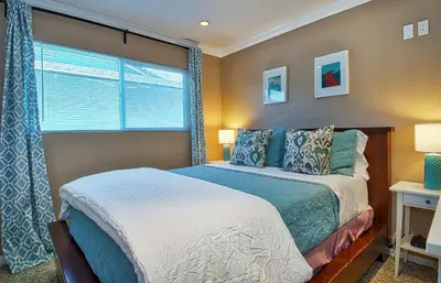 a bedroom with a bed and a window at F-20 Paradise Pier in Anaheim