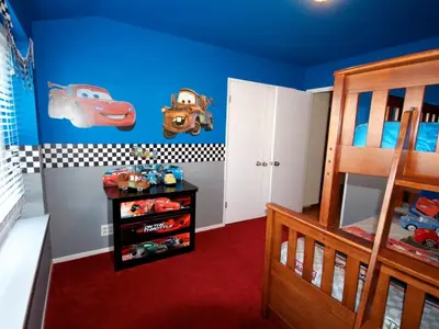a childs bedroom with blue walls and a bunk bed at F-21 Castle House 1 in Anaheim