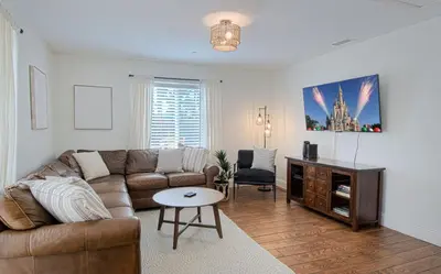 a living room with a couch and a table at F-22 Castle House 2 in Anaheim