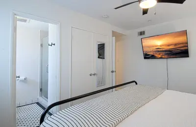 a bedroom with a bed and a painting on the wall at F-22 Castle House 2 in Anaheim