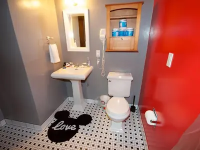 a small bathroom with a toilet and a sink at F-23 Rapunzels Tower in Anaheim