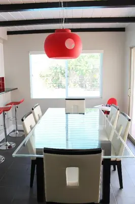 a dining room with a glass table and chairs at F-24 Mickeys House in Anaheim