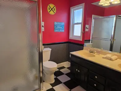 a bathroom with a toilet and a shower and a sink at F-34 Minnies House in Anaheim