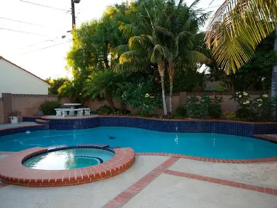 a small swimming pool with a brick border around it at F-34 Minnies House in Anaheim