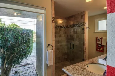 a bathroom with a shower and a sink at F-30 Small World in Anaheim