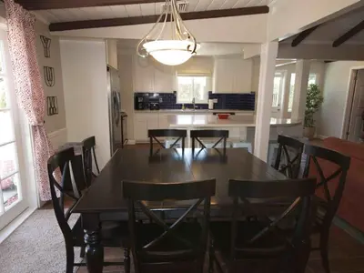 a dining room table and chairs in a kitchen at F-26 Andys House in Anaheim