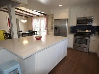 a kitchen with a large white island in a kitchen at F-26 Andys House in Anaheim
