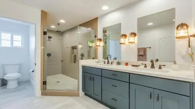 a bathroom with a sink and a shower and a toilet at F-27 Carnelian in Anaheim