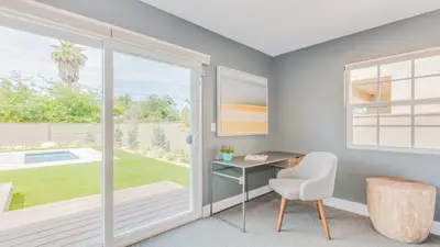a home office with a desk and a window at F-27 Carnelian in Anaheim