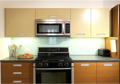 a kitchen with a stove and a microwave at Loft in Downtown Los Angeles in Los Angeles