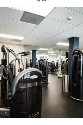 a gym with lots of treadmills and machines at Loft in Downtown Los Angeles in Los Angeles