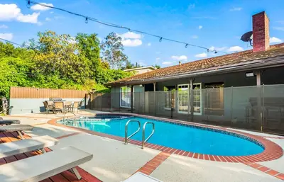 a swimming pool in the backyard of a house at Mulholland Drive with Spa & Game Room in Los Angeles