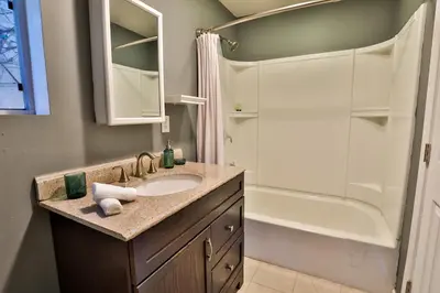 a bathroom with a sink and a shower at City Paradise Saltwater Pool-Spa and Ping-Pong in Los Angeles