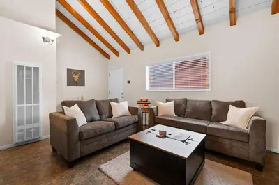 a living room with two couches and a coffee table at Bluebird Cabin, Indoor Fireplace, Next to Lake! in Green Valley Lake