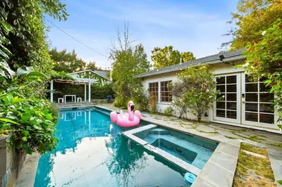 a swimming pool with a pink flamingo in a house at Pool & Spa Ping-Pong Mini-Golf & 5BR in Sherman Oaks