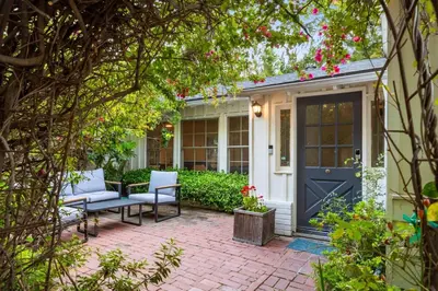 a front porch with a blue door and chairs at Pool & Spa Ping-Pong Mini-Golf & 5BR in Sherman Oaks