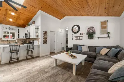 a living room with a couch and a table at Hummingbird Corner Pet Friendly Great Location Jacuzzi in Big Bear Lake