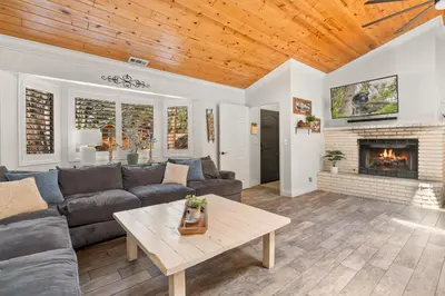 a living room with a couch and a fireplace at Hummingbird Corner Pet Friendly Great Location Jacuzzi in Big Bear Lake