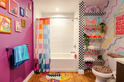 a colorful bathroom with a shower and a toilet at Colorful penthouse near DTLA in Los Angeles